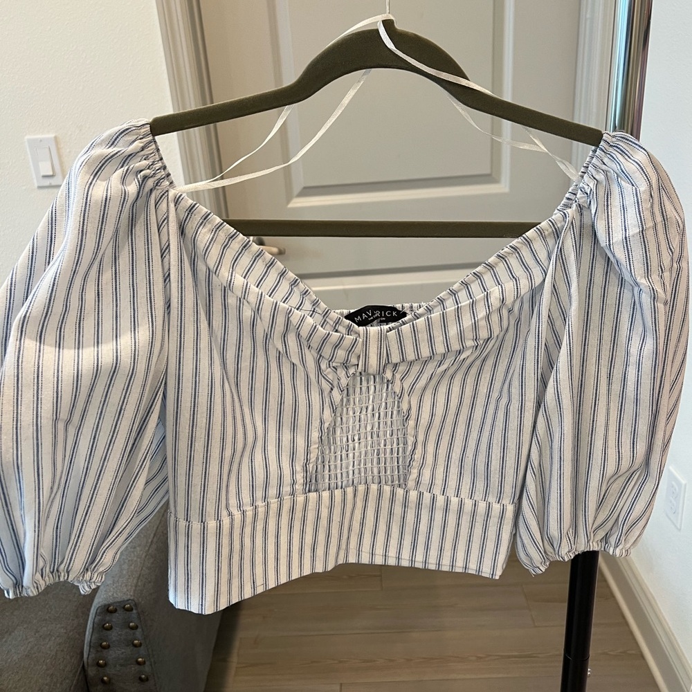 Cut out in the front.  Perfect for spring summer. Never worn. Elastic back
